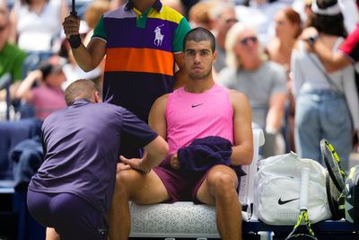 Carlos Alcaraz plays down concerns over knee issue after easing to victory