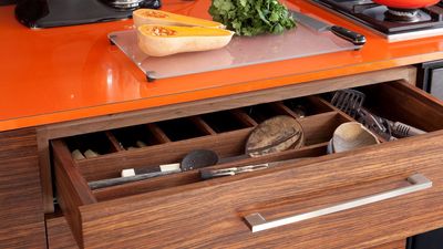 This $7.99 drawer organizer completely transformed how I store things in my tiny kitchen –and it comes in 7 colors