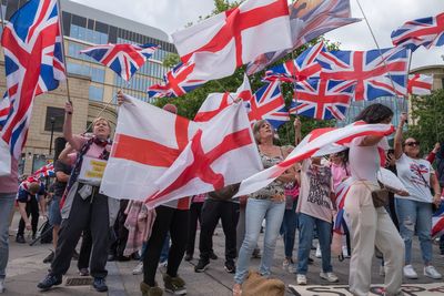 Masked men attempt to enter London asylum hotel as angry protests take place across UK after Epping ruling
