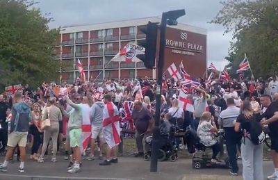 Police arrest five people as masked anti-asylum protesters try to storm hotel near Heathrow
