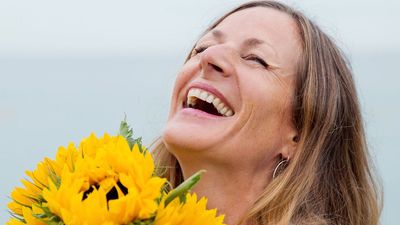 "I found laughter yoga so healing that I left my old life to teach it to others – people call me the Joy Queen"