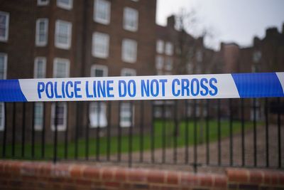 Murder investigation after woman falls from block of flats