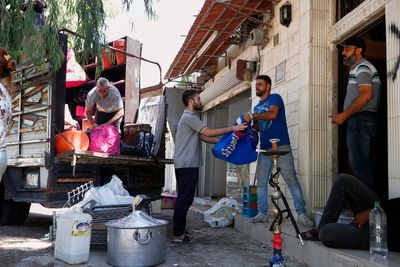 Alawite families flee Damascus suburb after violence and eviction threats