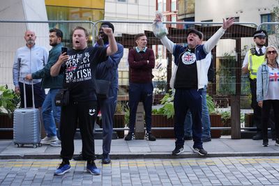 Police officer punched in face at anti-asylum protest in London