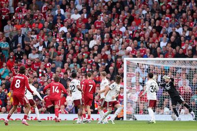 Arsenal goalkeeper David Raya points to new Puma ball after conceding long-range free-kick at Liverpool