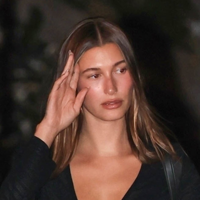Hailey Bieber Pairs $1,150 Saint Laurent Open-Toe Mules With a Lace-Up Blouse for Date Night