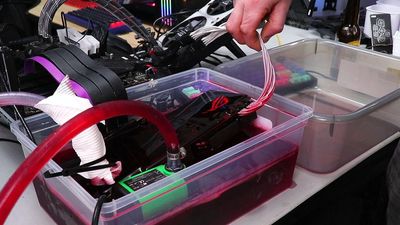 Nvidia 1080 Ti dunked into car transmission fluid for overclocking experiments using a Dodge Journey transmission cooler as a radiator — DIY immersion cooling rig delivers 7% to 16% gains