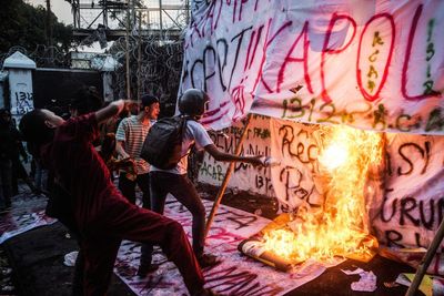 Twenty missing in Indonesia protests, rights group says