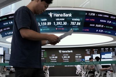 Asian shares are mixed and gold sets a fresh record high of over $3,550 per ounce