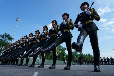 Who is attending China’s military parade and what weapons are going to be shown off?