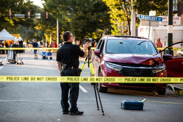 Minivan ploughs into Labor Day festival crowd leaving boy fighting for life