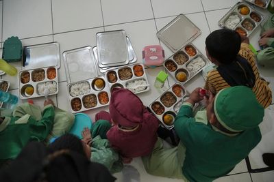 About 400 pupils fall sick after eating free school meals in Indonesia