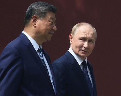 Putin hails ties with China as Kim Jong-un arrives in Beijing on eve of parade