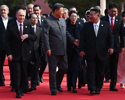 Xi Jinping says world faces ‘peace or war’, as Putin and Kim join him for military parade