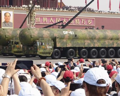 Nuclear triad and ‘robot wolves’: parade shows off array of Chinese weapons