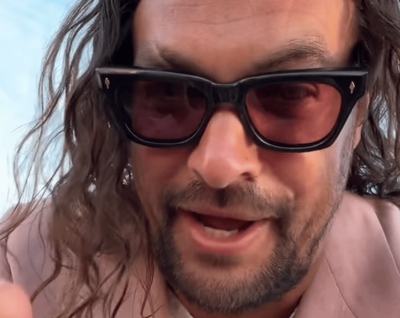 Jason Momoa disguises his 'ugly' feet with bright pink nail polish at In the Hand of Dante premiere