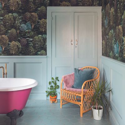 The once-dated 'bathroom lounge' has been given a trendy touch - here's why you need a chair in your bathroom
