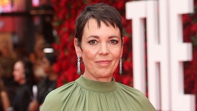 Olivia Colman's sage green ensemble is getting us in the mood for autumnal hues as she steps out for The Roses UK Premiere in London