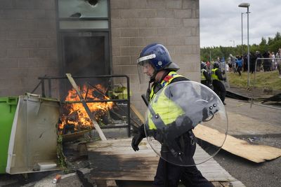 Rioter jailed for stoking fire outside asylum hotel