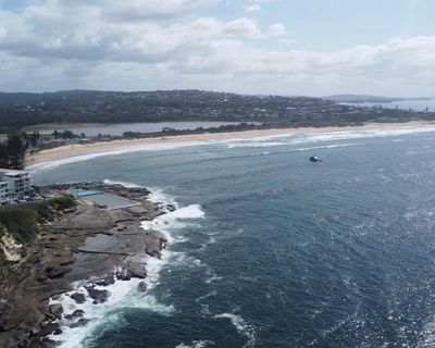 ‘Every surfer feeling this’: tight-knit community mourns fatal shark attack on Sydney’s northern beaches