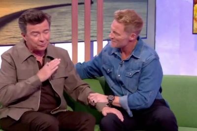 Rick Astley helped by Ronan Keating after coughing fit on TV