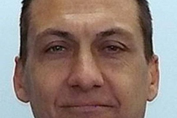 Australian authorities offer $1m bounty for fugitive gunman who shot dead two police officers