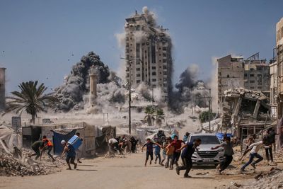 Israel flattens well-known landmark as Gazans run for cover