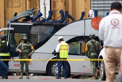 Freight train slams into a bus outside Mexico City and kills at least 8 people