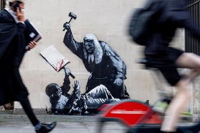 Could Banksy finally be unmasked? Police probe street artist's new work outside Royal Courts of Justice