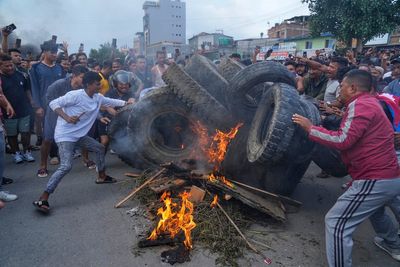 Nepalese PM steps down after 19 die in fiery clashes