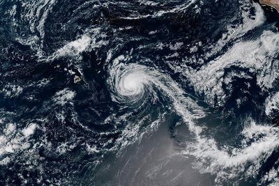 Hurricane Kiko weakens into a tropical storm but still could create dangerous surf in Hawaii