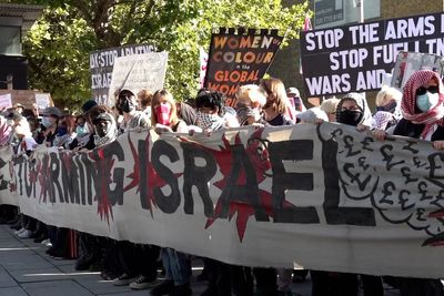 Three arrested after protest outside defence event