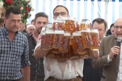 Pints go flying as waiter attempts to carry 31 beers in world record attempt
