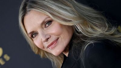 Michelle Pfeiffer's ceiling is the best complement to wooden cabinets I've ever seen – her kitchen's natural warmth is so beautiful and inviting