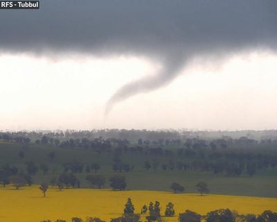 Tornado in central NSW and flood rescues in Sydney as wild weather soaks state
