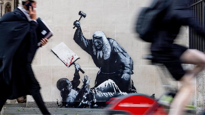 Is Banksy Guilty of 'Criminal Damage' and Should He Now Be Unmasked? Jail Time and Fines the Artist Now Faces