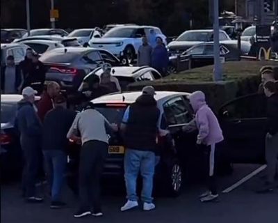 Men attack two cars in apparent anti-migrant vigilante violence in Belfast