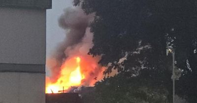 Firefighters work through night tackling blaze at recycling centre as roads closed
