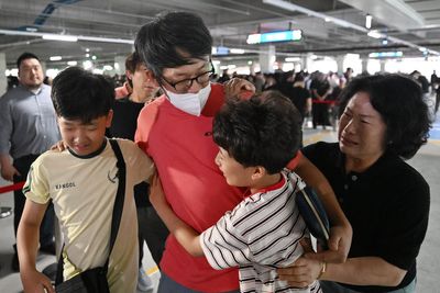 Hyundai workers arrive back in South Korea after US immigration raid ordeal