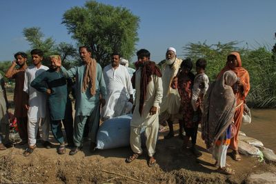 Floodwaters begin receding in a major Pakistani city but nearby towns face evacuations