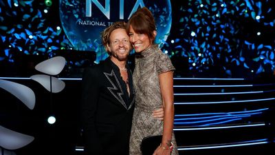 Exclusive: The surprising way Davina McCall's hair changed after brain surgery as she debuts chic up-do for NTAs