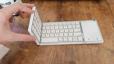 I tried a foldable Bluetooth keyboard for more desk space, but its range and flimsy build outweighed its practicality
