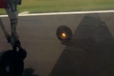 Wheel filmed falling off plane during takeoff as Mumbai airport declares emergency