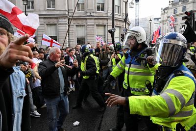 Dozens of police officers injured and 25 arrests as huge Tommy Robinson rally marred by violence