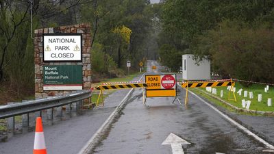 Locals plead for visitors to return to area of manhunt
