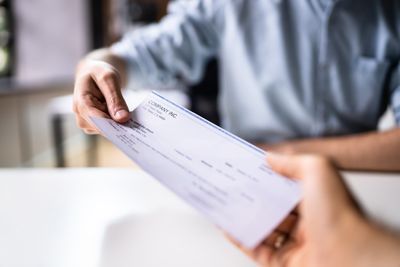 Why Do Some Employers Delay Paychecks to Trap Workers?