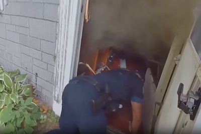 Firefighter crawls through smoke and broken glass to rescue elderly man from house fire