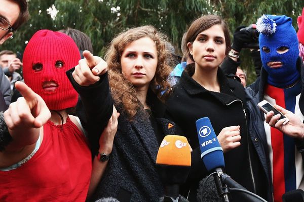 Russian court sentences Pussy Riot members in absentia to jail for anti-war performances