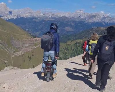 Tourist riding electric unicycle spotted on Dolomites hiking trail