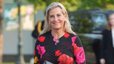 Duchess Sophie gives her favourite floral print a moody autumn update with berry tones and her embellished heels are the chicest finishing touch